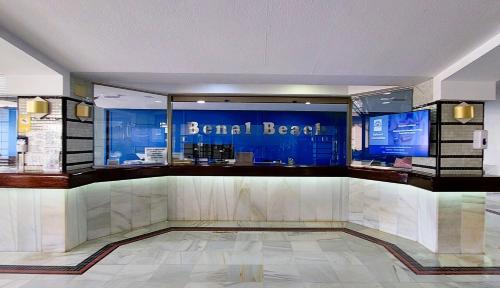 a lobby of a hotel with a sign that reads island beach at Benal Beach Vibe in Benalmádena