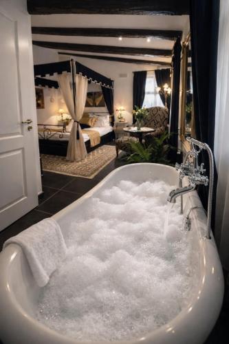a bathroom with a bath tub covered in snow at Bed&Breakfast Andio in Dubrovnik