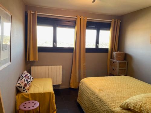 a bedroom with two beds and a window at Ocean View Oceanide in Lacanau-Océan