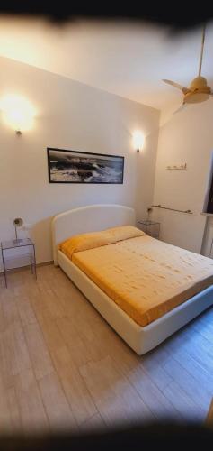 a bedroom with a large bed in a room at Residenza Zuc in San Vito lo Capo
