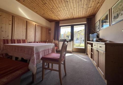 a room with a table and chairs and a window at Chalet Villa Josi Superior Appartement 11 in Leutasch