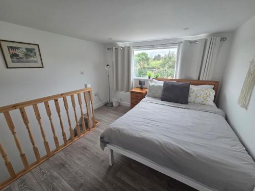 a bedroom with a bed and a window at Cottage in Sandwith in St Bees