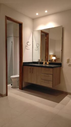 a bathroom with a sink and a mirror at 31 Exclusive Cabin with Private Jacuzzi, Beach in Tubará