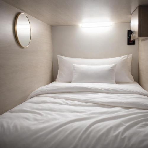 a large white bed in a room with a mirror at Burdubai Vacation Homes in Dubai