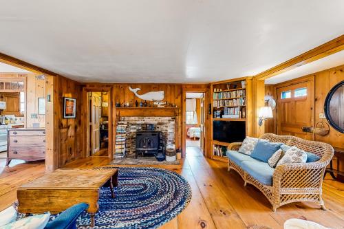 a living room with a couch and a fireplace at 1 Mi to Beach! Family-Friendly Nantucket Retreat in Nantucket