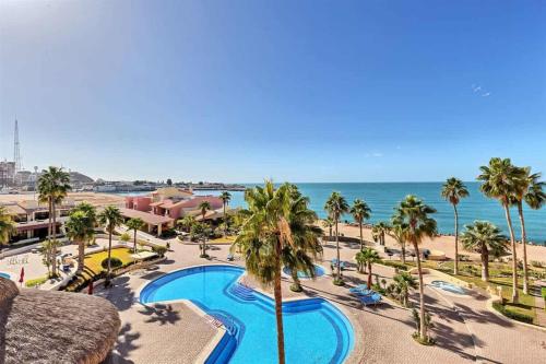 a view of a resort with a swimming pool and the beach at Charming Condo in Great Location Pinacate 412 in Puerto Peñasco