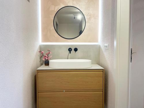 a bathroom with a sink and a mirror at Schönes Apartment Traumblick mit Balkon Bad Ems in Bad Ems