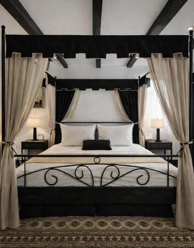 a bedroom with a large bed with curtains at Bed&Breakfast Andio in Dubrovnik