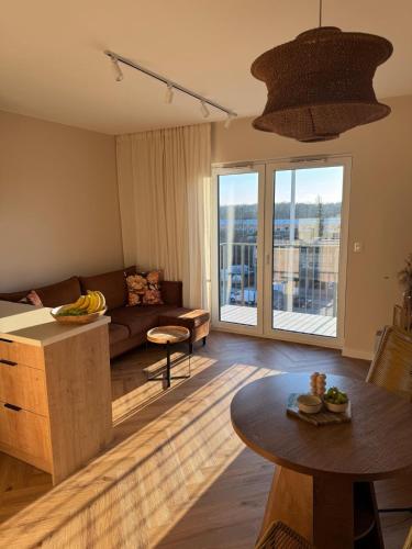 a living room with a couch and a table at BonjourApart in Łódź