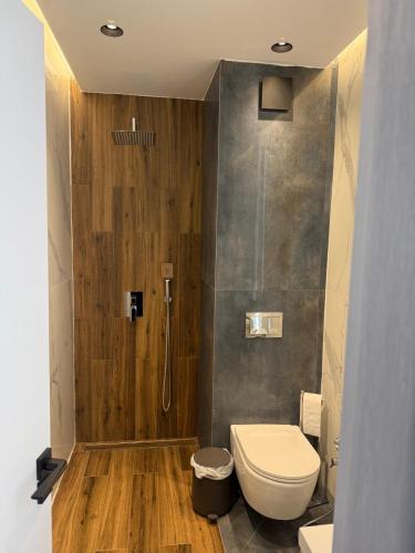 a bathroom with a toilet and a shower at Forest Panorama Luxury Apartment in Velingrad