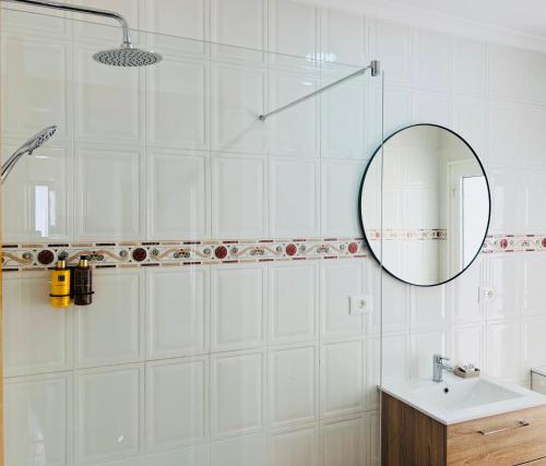 a bathroom with a mirror and a sink at Canaryislandshost l Bruma in Famara