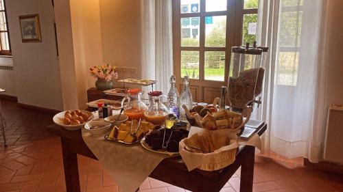 a table with a bunch of food on it at 8380 Agriturismo il Saragiolo in Manciano