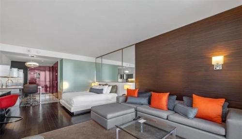 a living room with a couch and a bed at Justin's at Palms Place in Las Vegas