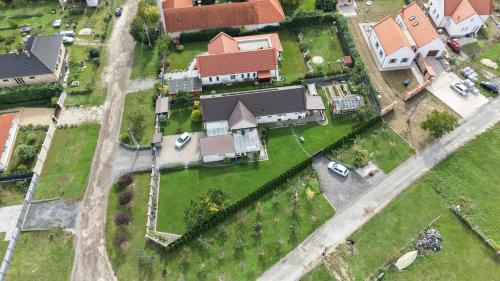 an aerial view of a house with a yard at Ölyv in Fertőrákos