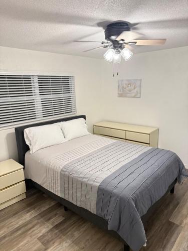 a bedroom with a bed and a ceiling fan at Welcome to Highland Shore in Ellenton