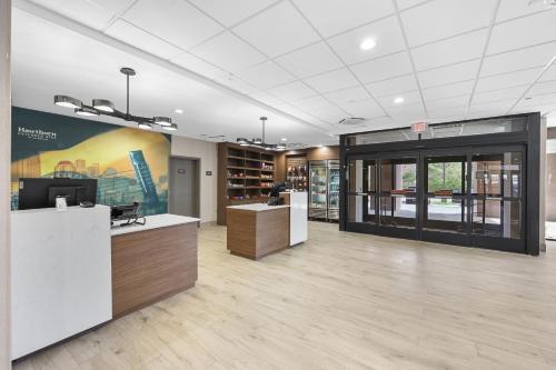an office lobby with a desk with a computer on it at La Quinta by Wyndham Nashville Airport/Opryland in Nashville