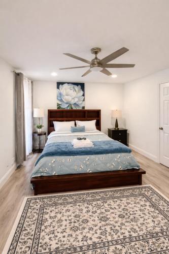 a bedroom with a bed and a ceiling fan at Stunning Home in Plano! in Plano