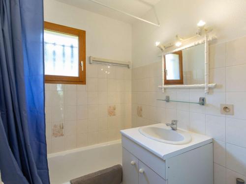 a bathroom with a sink and a mirror and a tub at Chalet terrasse - 5 pers. Cauterets calme - FR-1-401-322 in Cauterets
