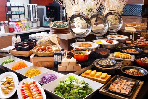 a buffet with many different types of food on display at Art Hotel Niigata Station in Niigata