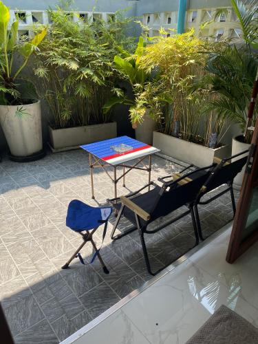 a table and two chairs and a table and chairs at Lilly house near Krabi Airport with Free Airport Shuttle in Krabi