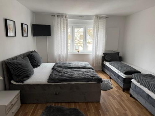 a bedroom with two beds and a window at Romantica in Rust