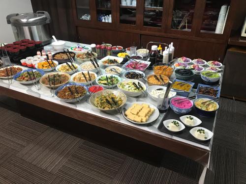 a buffet with many different types of food on a table at Hotel Sincerity kani in Kani