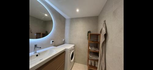 a bathroom with a sink and a mirror at Apartment Bergen Central - private balcony in Bergen
