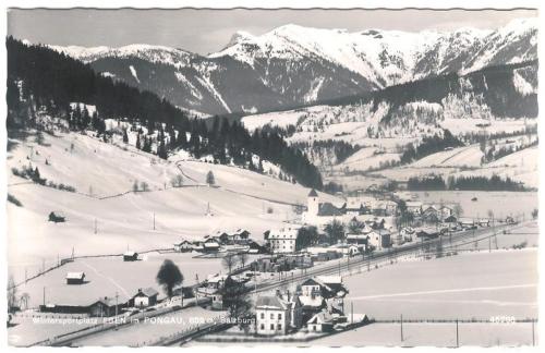 a black and white photo of a village in the snow at Landhotel Berger in Eben im Pongau