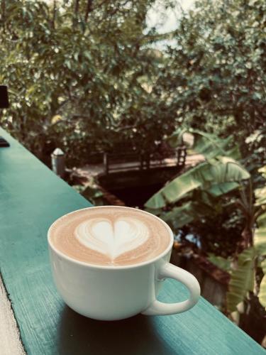 a cup of coffee sitting on a table at The beach gate villa in Beruwala