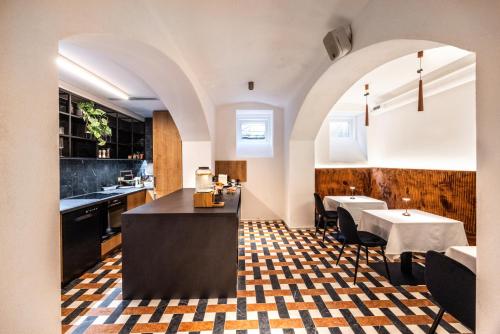 a kitchen and dining room with a table and chairs at Hiša F5 in Ljubljana