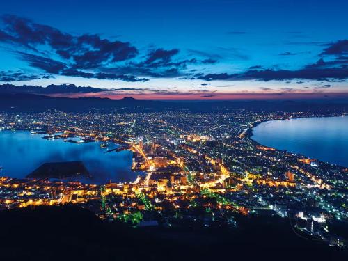 an aerial view of a city at night at Tasogare Baycity in Hakodate