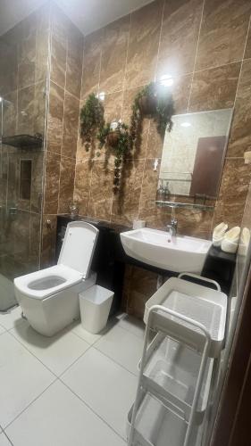a bathroom with a toilet and a sink at High floor City view 2BR condo in Johor Bahru