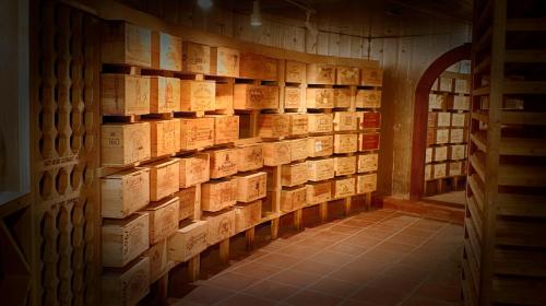 a room filled with lots of wooden wine bottles at Curtain Bluff - All Inclusive in Old Road