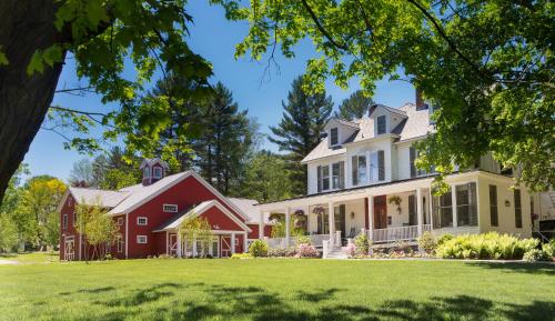 a house with a red and white house at The Inn at Manchester in Manchester