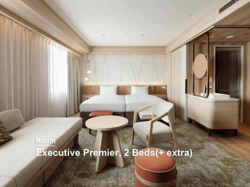 a hotel room with two beds and a table at Mitsui Garden Hotel Sapporo in Sapporo
