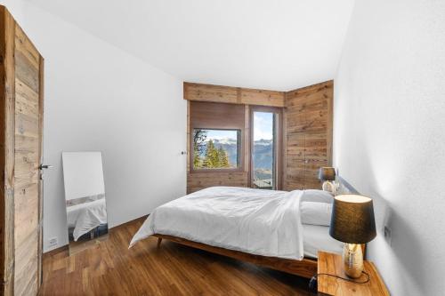 Sagittaire T06 sur la place du village a Anzere avec vue sur les Alpes