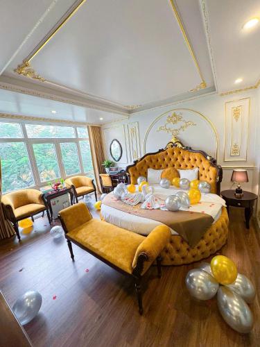 a bedroom with a large bed with stuffed animals on it at khách sạn Aloha in Hanoi