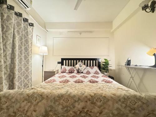 a bedroom with a large bed with pillows on it at Premium 2BHK Apartment by Key Stays - Hyd in Hyderabad