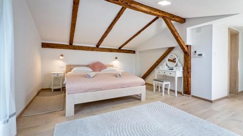 a bedroom with a bed in a room with wooden beams at Villa Tia by Villas Guide in Karlovac