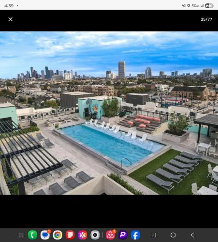 a view of a pool on top of a building at Modern King Bed Unit with Arcade at The Vic Walk to Midtown Downtown in Houston
