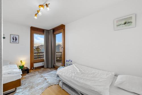 Saphir 404 pres de la telecabine a Anzere avec vue sur les Alpes
