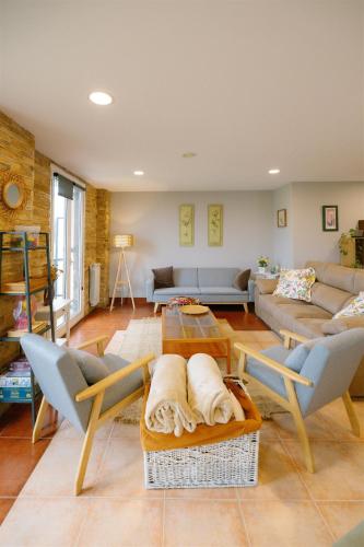 a living room with a couch and a table at Amari in Getaria