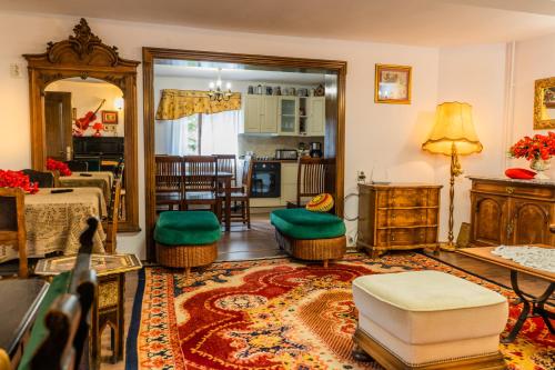 a living room with a couch and a table at SemiLuna in Buşteni