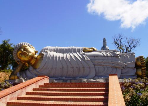 a large statue of a buddha with stairs in front at Hotel Cristal Caldas in Caldas da Rainha