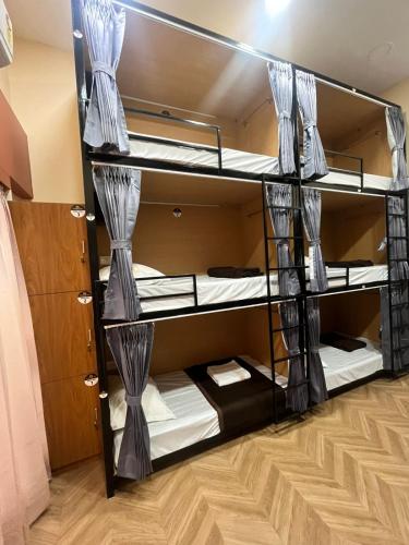 a room with bunk beds in a dorm room at Bachelor Stay - CBD Belapur in Navi Mumbai