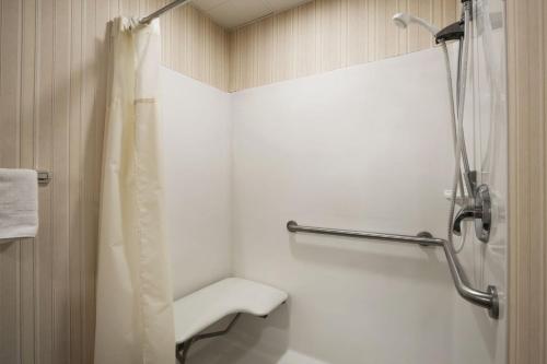 A bathroom at Days Inn & Suites by Wyndham Cherry Hill - Philadelphia