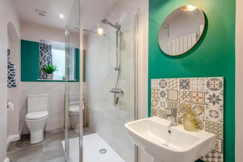 a bathroom with a sink and a toilet and a mirror at 2 Bed in Shepley oc-c36884 in Shepley