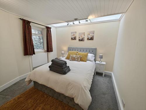 a bedroom with a large bed with a window at 1 Bed in Hexham oc-g37537 in Hexham