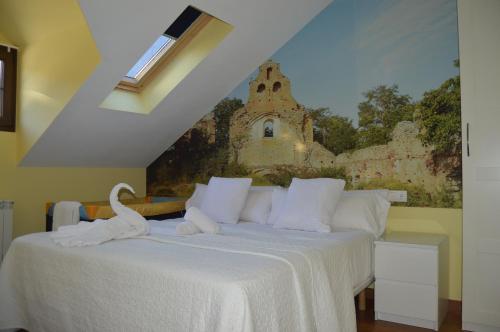 Un ou plusieurs lits dans un hébergement de l'établissement The Way Hotel Molinaseca