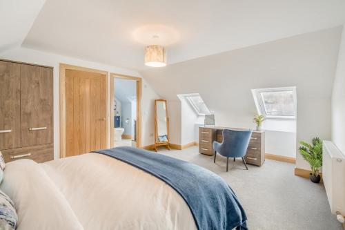a bedroom with a bed and a desk and a chair at 3 Bed in Dunning oc-t35973 in Dunning